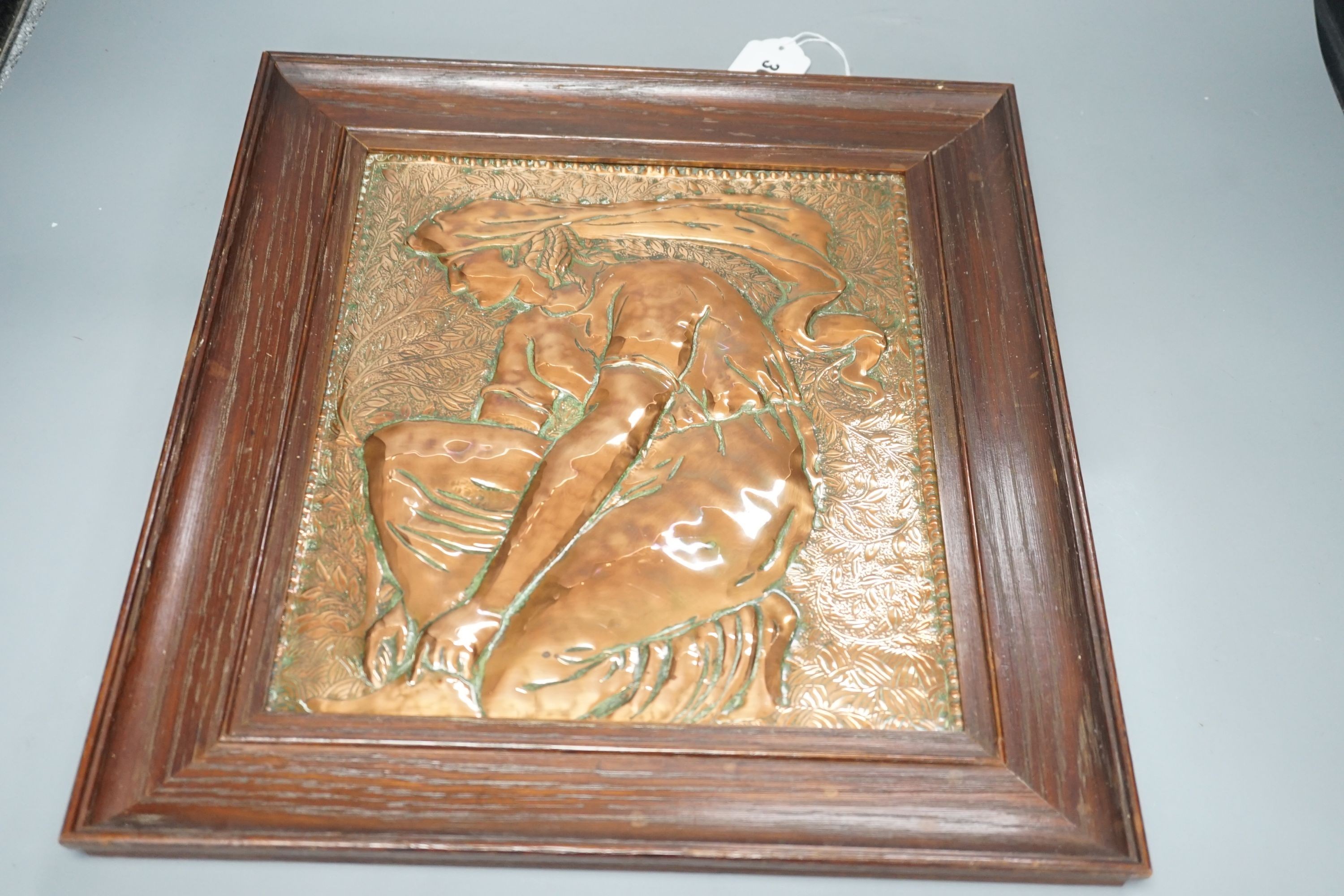 An Arts & Crafts repousse copper plaque, in oak frame, c.1900 - 38 x 43cm